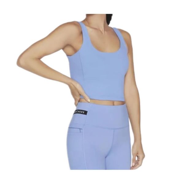 Biustonosz sportowy Skechers. Niebieskie biustonosze sportowe damskie Skechers, bez wzorów. Za 134.99 zł.