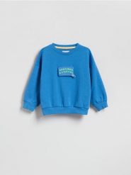 Bluza z aplikacją - niebieski. Niebieskie bluzy i bluzki niemowlęce Reserved, z aplikacjami, z bawełny, bez ramiączek, bez kaptura. Za 49.99 zł.
