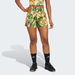 Szorty adidas x FARM Rio Pacer. Zielone spodenki sportowe damskie Adidas, bez wzorów, z materiału, sportowe. W wyprzedaży za 107.40 zł.