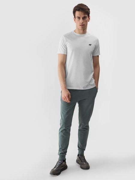 4F Spodnie dresowe joggery męskie - khaki XL. Brązowe spodnie dresowe męskie 4f, bez wzorów, z bawełny. W wyprzedaży za 79.99 zł.