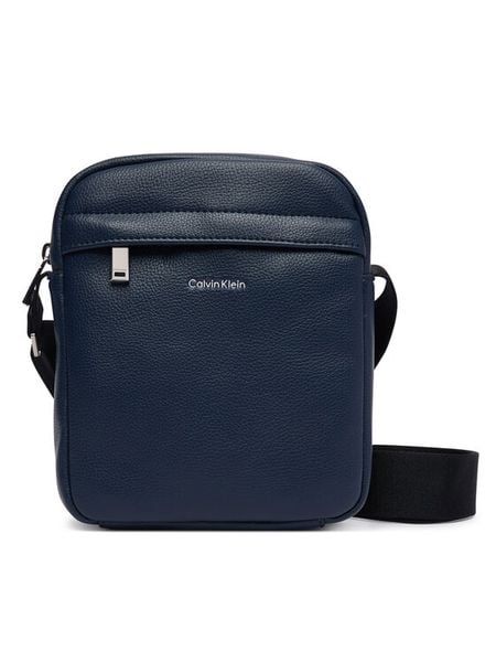 Calvin Klein Saszetka Raised Reporter LV04D3160G Granatowy. Niebieskie saszetki męskie CALVIN KLEIN, ze skóry. Za 329.99 zł.