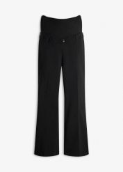 Wygodne spodnie ciążowe ze stretchem o kroju bootcut. Czarne spodnie materiałowe damskie bonprix, bez wzorów, moda ciążowa. Za 179.99 zł.
