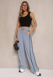 Niebieskie Szerokie Spodnie Dresowe High Waist Zdobione Lampasami Sopaline. Niebieskie spodnie dresowe damskie Renee, l, z aplikacjami, z dresówki. Za 49.99 zł.
