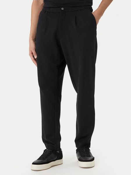 Calvin Klein Spodnie materiałowe LV04LF607G Czarny Tapered Fit. Czarne spodnie materiałowe męskie CALVIN KLEIN, bez wzorów, z materiału. Za 529.99 zł.