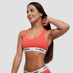 Biustonosz damski sportowy bez zapięcia czerwony Braletka. Czerwone biustonosze sportowe damskie GYMBEAM, bez wzorów, z bawełny. Za 55.90 zł.