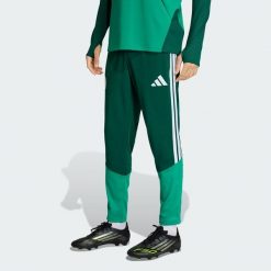 Spodnie treningowe Algeria 26. Zielone spodnie dresowe męskie Adidas, bez wzorów, z dresówki. Za 279.00 zł.