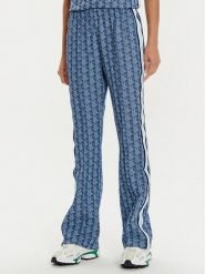 Lacoste Spodnie dresowe XF9313 Niebieski Regular Fit. Niebieskie spodnie dresowe damskie Lacoste, bez wzorów, z dresówki. Za 589.99 zł.