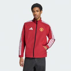 Podstawowa bluza reprezentacyjna Manchester United. Czerwone bluzy bez kaptura męskie Adidas, l, z materiału. Za 529.00 zł.