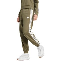 Spodnie damskie adidas Essentials 3-Stripes Fleece Loose-Fit. Zielone spodnie sportowe damskie Adidas, l, z bawełny, na fitness i siłownię. Za 171.99 zł.