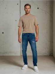 Jeansy slim z dziurami - granatowy. Niebieskie jeansy męskie Sinsay. Za 79.99 zł.