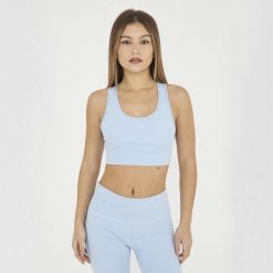 Crop top sportowy treningowy FEBE. Niebieskie topy sportowe damskie Legea, s, bez wzorów, z materiału, bez ramiączek. W wyprzedaży za 84.50 zł.