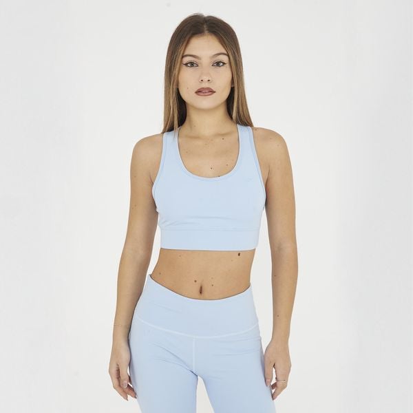 Crop top sportowy treningowy FEBE. Niebieskie topy sportowe damskie Legea, s, bez wzorów, z materiału, bez ramiączek. W wyprzedaży za 84.50 zł.