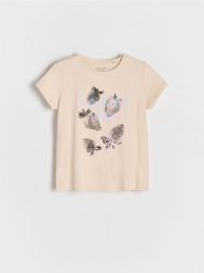 T-shirt z wypukłym nadrukiem - kremowy. Białe koszulki dziewczęce Reserved, bez wzorów, z bawełny, bez ramiączek. Za 19.99 zł.