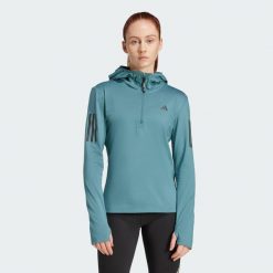 Bluza Own The Run Winterized Hooded Half-Zip. Niebieskie kurtki do biegania damskie Adidas, xs, bez wzorów, z kapturem, climawarm (adidas). W wyprzedaży za 257.50 zł.