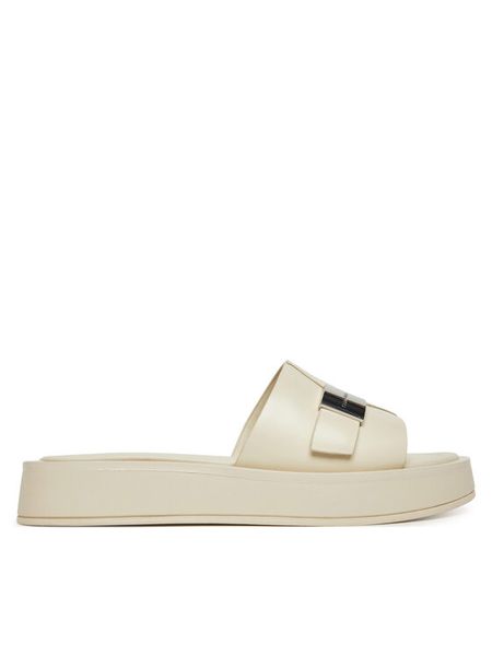 Calvin Klein Klapki Flatform Slide W/Ck Hw - Lth HW0HW02368 Écru. Białe klapki damskie CALVIN KLEIN, bez wzorów, ze skóry, bez obcasa. Za 512.99 zł.