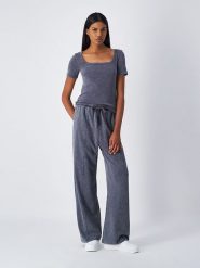 Champion Spodnie dresowe w kolorze antracytowym rozmiar: S. Czarne spodnie dresowe damskie CHAMPION, s, bez wzorów, z dresówki. Za 87.40 zł.