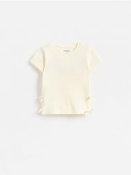 T-shirt z kokardkami - złamana biel. Koszulki dziewczęce Reserved, m, bez wzorów, z bawełny, bez ramiączek. Za 25.99 zł.