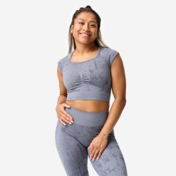 Koszulka fitness damska Domyos crop top seamless. Szare bluzki damskie DOMYOS, xl, z materiału, bez kołnierzyka, bez ramiączek. Za 89.99 zł.