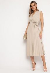 Beżowa Sukienka Ymir. Brązowe sukienki damskie Born2be, na imprezę, bez wzorów, z materiału, eleganckie, bez kołnierzyka, bez ramiączek, maxi, kopertowe. W wyprzedaży za 71.99 zł.