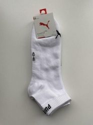 Skarpety unisex Puma QUARTER. Czarne skarpetki damskie Puma, bez wzorów, z syntetyku. Za 66.99 zł.