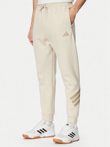 Adidas Spodnie dresowe Future Icons 3-Stripes KD5206 Beżowy Regular Fit. Brązowe spodnie dresowe męskie Adidas, bez wzorów, z bawełny. Za 196.99 zł.