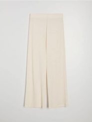 Strukturalne spodnie wide leg - kremowy. Białe spodnie materiałowe damskie Sinsay, bez wzorów. Za 39.99 zł.