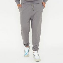 Spodnie sportowe unisex F BALLON szare. Szare spodnie dresowe damskie Legea, bez wzorów, z gumy. W wyprzedaży za 92.00 zł.