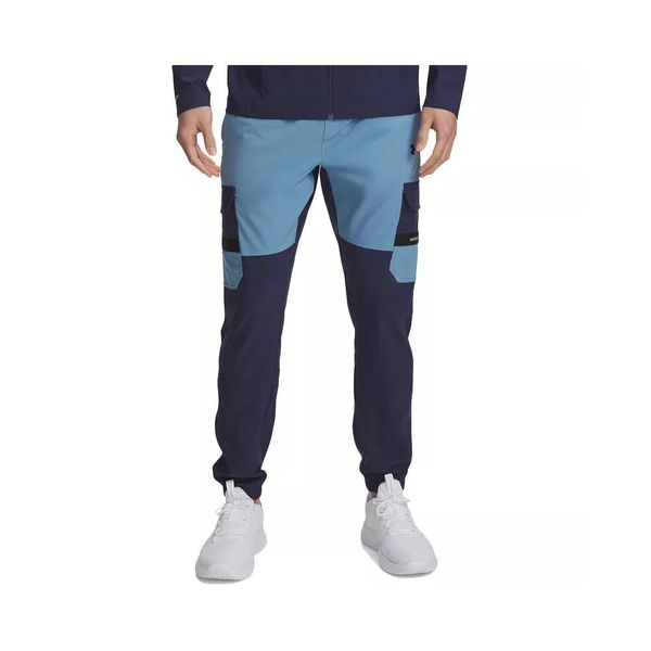 Spodnie dresowe Under Armour TECH UTILITY WOVEN. Niebieskie spodnie sportowe męskie Under Armour, z dresówki. Za 345.15 zł.