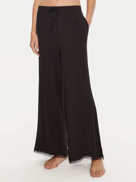 Tommy Hilfiger Spodnie piżamowe UW0UW05575 Czarny Relaxed Fit. Czarne piżamy damskie Tommy Hilfiger, s, bez wzorów, bez ramiączek. Za 149.99 zł.