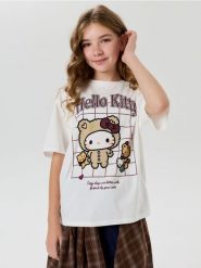 Bawełniana koszulka oversize z nadrukiem Hello Kitty - kremowy. Białe koszulki dziewczęce Sinsay, l, bez wzorów, z bawełny, bez ramiączek. Za 15.99 zł.