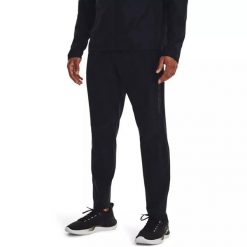 Spodnie dresowe męskie Under Armour STORM RUN PANT. Czarne spodnie dresowe męskie Under Armour, bez wzorów, z dresówki. Za 229.99 zł.