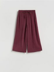 Luźne spodnie z modalem - bordowy. Czerwone spodnie materiałowe damskie Reserved, bez wzorów, z tkaniny. Za 119.99 zł.