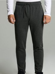 Spodnie dresowe ze strukturalnej dzianiny - czarny. Czarne spodnie sportowe męskie Sinsay, z dresówki. Za 49.99 zł.