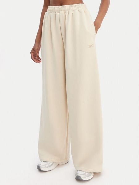 Reebok Spodnie dresowe Reebok x Ewa Chodakowska RK25624CCW Beżowy Wide Leg. Brązowe spodnie dresowe damskie Reebok, m, bez wzorów, z dresówki. Za 199.99 zł.