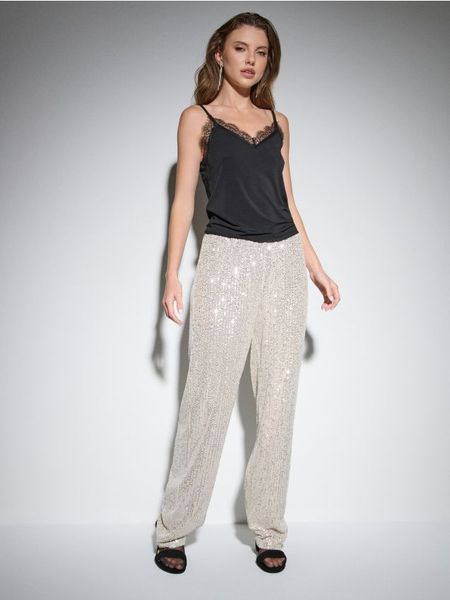 Spodnie wide leg z połyskującymi cekinami - srebrny. Szare spodnie materiałowe damskie Sinsay, bez wzorów. Za 59.99 zł.