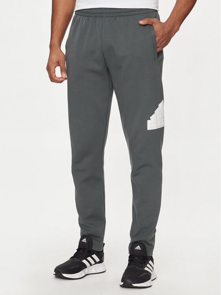 Adidas Spodnie dresowe Future Icons Badge of Sport IR9177 Szary Regular Fit. Szare spodnie dresowe męskie Adidas, bez wzorów, z dresówki. Za 189.99 zł.