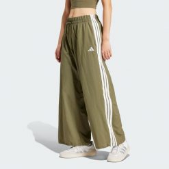 Spodnie Essentials 3-Stripes Lifestyle Woven Parachute. Białe spodnie dresowe damskie Adidas, xl, z materiału, na fitness i siłownię. Za 245.50 zł.