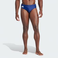 Szorty do pływania Solid. Białe szorty męskie Adidas, bez wzorów, z materiału. Za 89.95 zł.