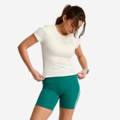 Koszulka fitness damska Domyos prążkowana. Białe bluzki damskie DOMYOS, s, bez wzorów, z elastanu, bez ramiączek. Za 69.99 zł.