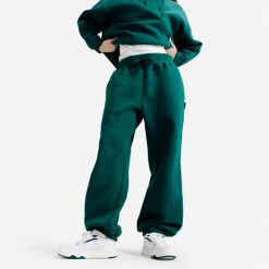 Spodnie damskie Elementals. Zielone spodnie materiałowe damskie Decathlon, bez wzorów, z bawełny. Za 149.99 zł.
