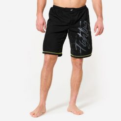 Spodenki do MMA męskie. Czarne szorty męskie DOMYOS, z elastanu, bez kołnierzyka. Za 99.99 zł.
