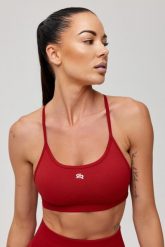Stanik sportowy bezszwowy Rough Radical Seamless Glow Bra. Czerwone biustonosze sportowe damskie ROUGH RADICAL, bez wzorów, z dzianiny. Za 129.90 zł.