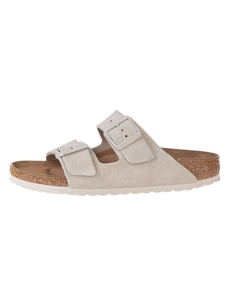 Birkenstock Skórzane klapki w kolorze kremowym rozmiar: 40. Białe klapki damskie Birkenstock, bez wzorów, bez obcasa. Za 414.95 zł.