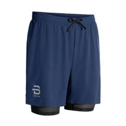 Szorty 2 w 1 Daehlie Sportswear. Niebieskie szorty męskie DAEHLIE, z elastanu, bez kołnierzyka. Za 290.00 zł.