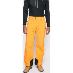 Columbia - Spodnie snowboardowe Millenium Blur. Brązowe spodnie materiałowe męskie Columbia, bez wzorów, z elastanu. W wyprzedaży za 359.90 zł.