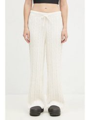 Adidas Spodnie dresowe "KNTD Jogger" w kolorze kremowym rozmiar: S. Brązowe spodnie dresowe damskie Adidas, s, bez wzorów, z dresówki. Za 205.36 zł.