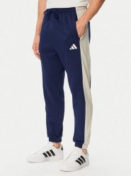 Adidas Spodnie dresowe Seasonal Essentials Colorblock Fleece KF4211 Niebieski Cosy Fleece Fit. Niebieskie spodnie dresowe męskie Adidas, bez wzorów, z bawełny. Za 239.99 zł.