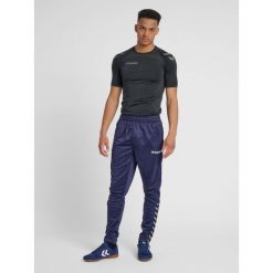 Spodnie Hummel hmlAUTHENTIC Training. Niebieskie spodnie dresowe męskie HUMMEL, bez wzorów, z dresówki. W wyprzedaży za 153.00 zł.