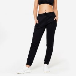 Spodnie dresowe damskie Domyos Gym & Pilates slim. Czarne spodnie dresowe damskie DOMYOS, xl, z dresówki, na fitness i siłownię. Za 89.99 zł.
