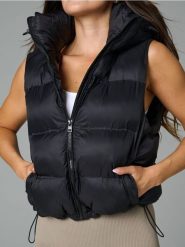 Kamizelka - czarny. Czarne kamizelki damskie Sinsay, l, z materiału. Za 79.99 zł.